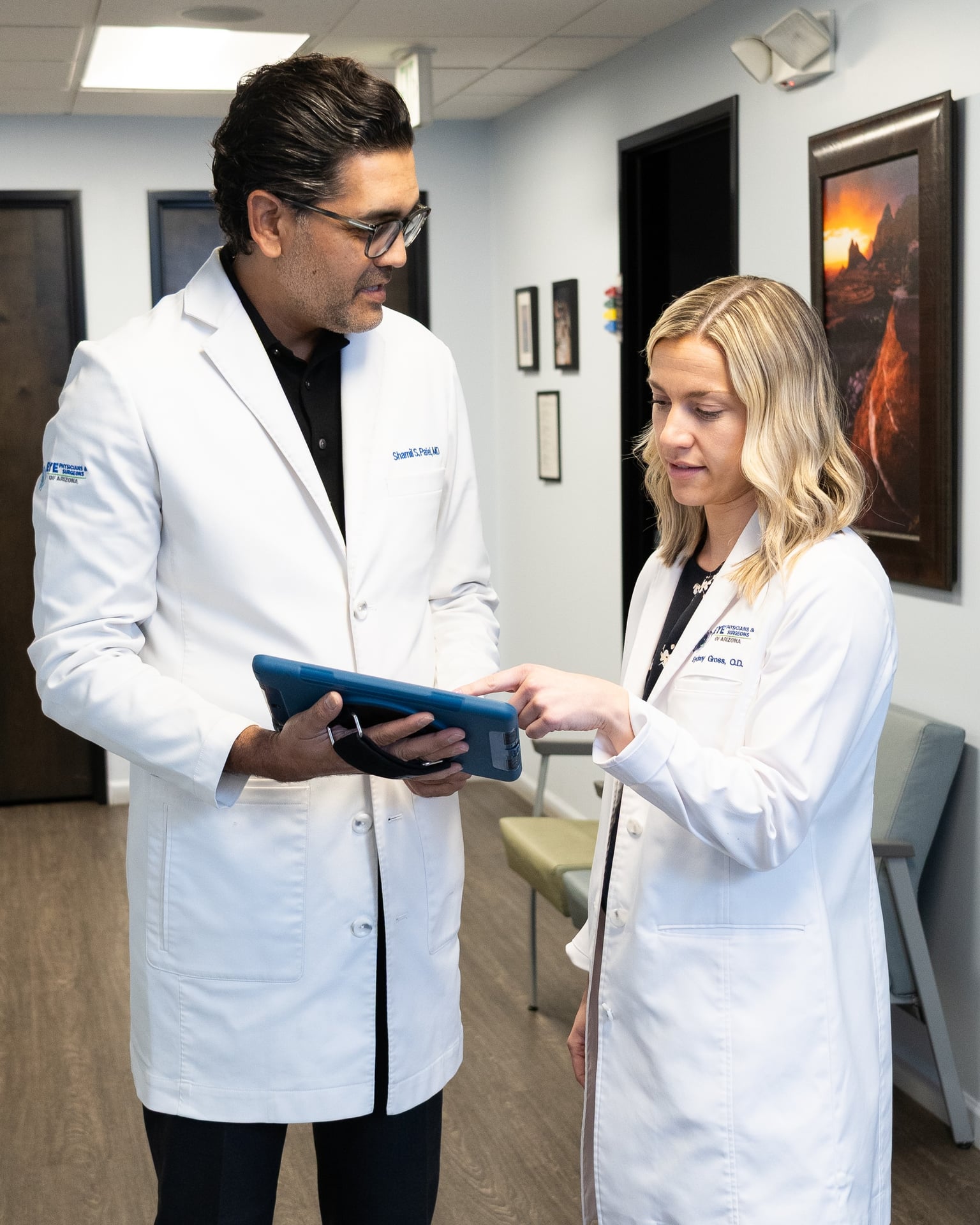 Dr. Patel and Dr. Gross reviewing a patient chart